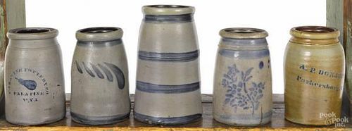 Five stoneware churns, 19th c., with cobalt dec