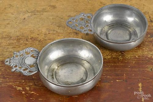 Two New England pewter porringers, one bearing