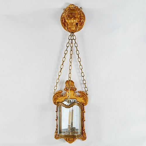 Monumental George II style giltwood lion sconce