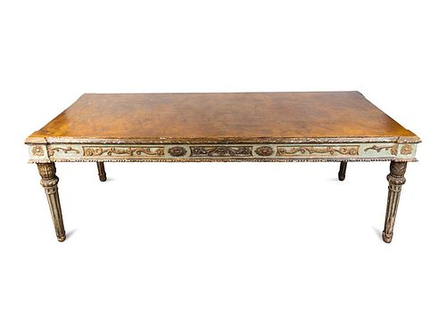 An Italian Neoclassical Style Painted and Parcel Gilt Center Table
Height 31 1/2 x width 89 1/4 x depth 37 1/4 inches.