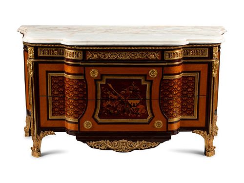 A Regence Style Marquetry Inlaid Gilt Bronze Mounted Marble Top Commode
Height 38 x width 69 x depth 27 inches.