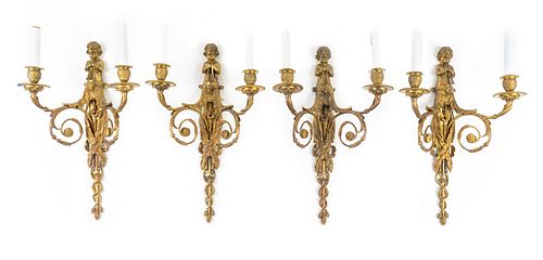 A Set of Four Louis XVI Style Gilt-Bronze Sconces
Height 18 x width 11 1/2 x depth 6 inches.