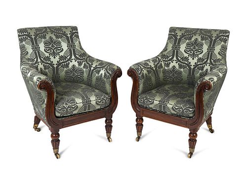 A Pair of Regency Faux Rosewood Upholstered Bergeres Attributed to Gillows Height 38 1/2 x width 30 3/4 x depth 32 1/2 inches.
