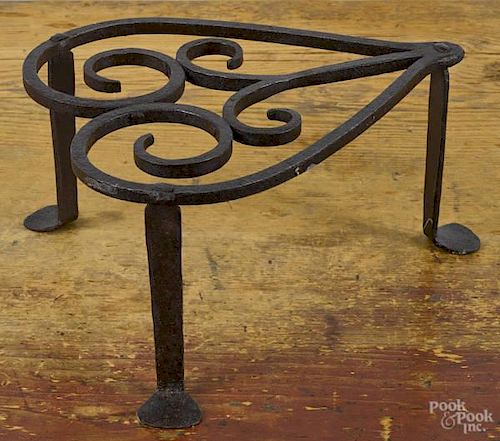 Wrought iron heart trivet, ca. 1800, with penny