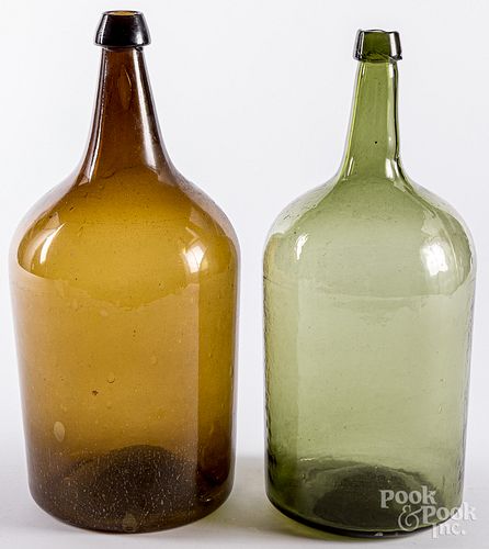 Two large antique glass bottles