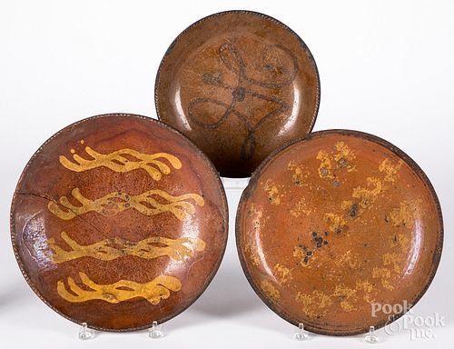 Three redware chargers, 19th c.