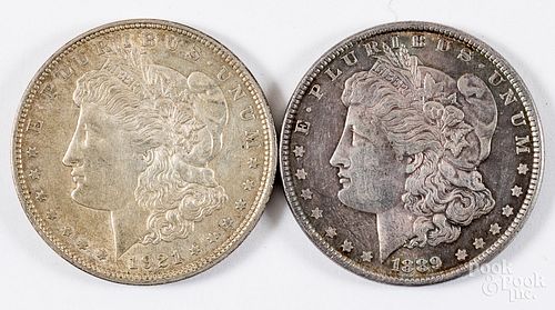 Two Morgan silver dollars; 1921-D and 1889.