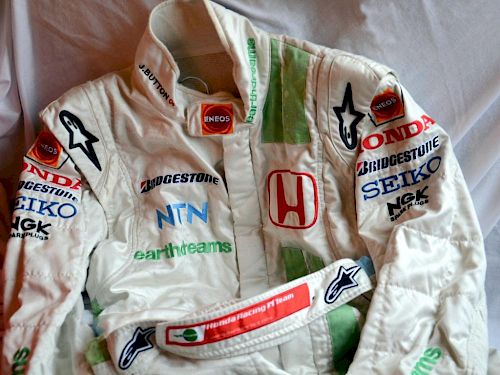 An original race-worn suit as used during the 2007 season. Button was driving the Honda RA107, with