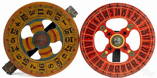 Two painted gaming wheels, early 20th c., 24'' d