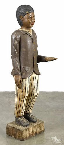 Carved and painted figure, 20th c., of a black