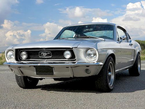 The Fastback option of the Mustang appeared in 1965, with the model's first significant facelift fol