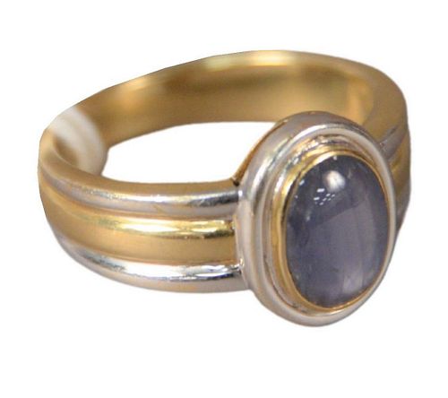 18 Karat White and Yellow Gold Ring, set with star sapphire, size 9, 9.2 grams.