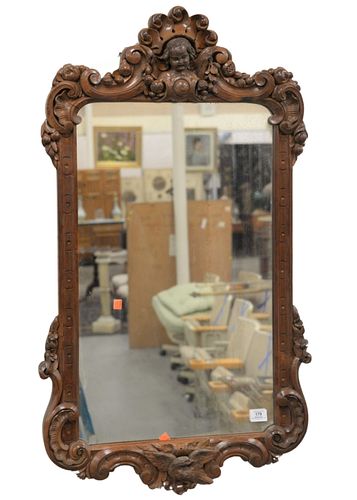 American Victorian Rosewood Rectangular Mirror, with carved puttis, height 45 inches, width 23 inches.