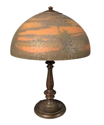 Handel Reverse Painted Table Lamp, having reverse painted sunset landscape scene on waters edge, resting on bronze base, shade signed on the rim: Hand