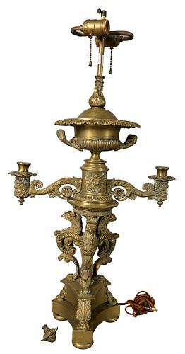 Pair of French Empire Bronze Two Light Table Lamps, both having two candle arms and decorated with eagle forms around the base, overall height 35 inch