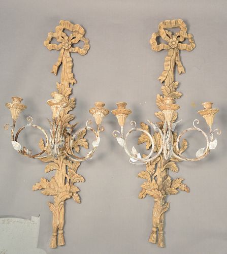 Pair of Italian Carved Wood and Tole Sconces, each having three lights on scrolling arms with bow form on top, length 36 1/2 inches, width 16 inches.