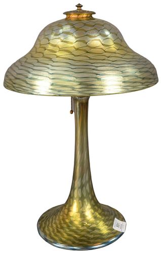 Tiffany Studios Favrile Glass Table Lamp having stepped dome shade with Favrile wave pattern in yellow, green, blue, and gold iridescence, resting on 