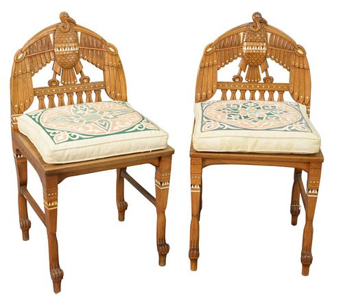 Pair of Egyptian Revival Side Chairs, having bird motif and woven seats with custom cushions, height 34 inches, width 18 inches, depth 19 inches.