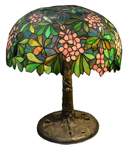 Large American Leaded Glass Lamp, having apple blossom conical shade, resting on tree form base with six lights, height 28 inches, diameter 22 inches.