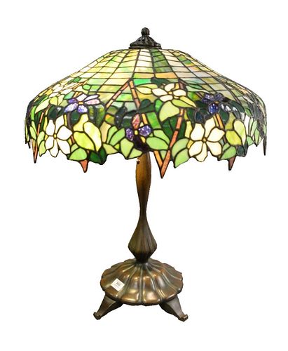 Large American Leaded Glass Peony Table Lamp, having patinated bronze four-light base, supporting shade with purple and white flowers, pale green leaf