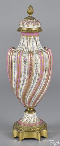 Sevres ormolu mounted porcelain urn and cover, late 19th c., 19'' h.