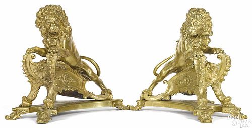 Pair of French gilt bronze lion chenets, 19th c., 14 3/4'' h., 15'' w. Provenance: DeHoogh Gallery