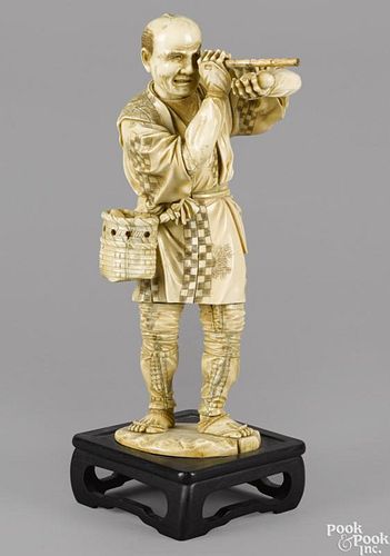 Large Japanese Meiji period carved ivory figure of a man with a spyglass, 14 1/4'' h.