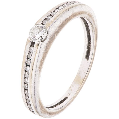 RING WITH DIAMONDS IN 18K WHITE GOLD 25 Brilliant cut diamonds ~0.25 ct. Weight: 3.2 g. Size: 5 ¾