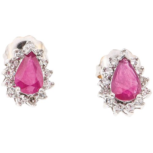 PAIR OF STUD EARRINGS WITH RUBIES AND DIAMONDS IN 14K WHITE GOLD 2 Pear cut rubies ~0.70 ct and 26 8x8 cut diamonds ~0.26 ct