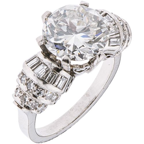 RING WITH DIAMONDS IN PLATINUM 1 Brilliant cut diamond ~3.90ct, 33 Diamonds (different cuts) ~0.88ct. Weight: 9.5 g. Size: 6¾
