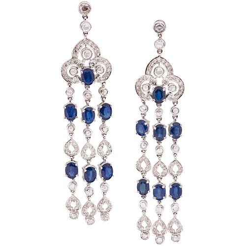 PAIR OF EARRINGS WITH SAPPHIRES AND DIAMONDS IN 18K WHITE GOLD 14 Oval cut sapphires ~13.49 ct and diamonds (different cuts) ~5.52 ct