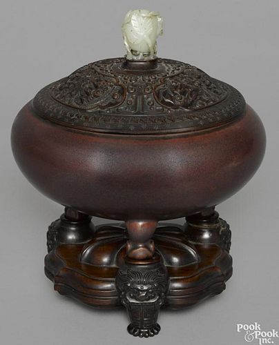 Chinese Qing dynasty iron red glaze censer, 18th c., with a carved hardwood cover and stand