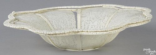 Chinese carved ivory basket, late 19th c., with a double-swing handle, 2'' h., 10'' w.