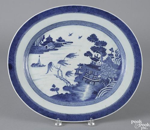 Chinese export porcelain blue and white Nanking platter, 19th c., 15'' l., 17 1/4'' w.