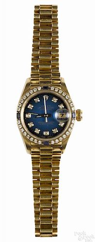 Lady's Rolex Oyster Perpetual Date gold wristwatch, 18K with a diamond and sapphire bezel