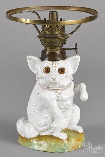 Miniature porcelain figural seated dog lamp, 19th c., 8 1/2'' h.