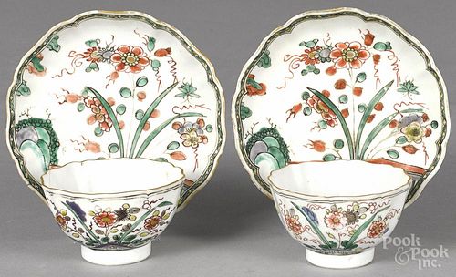 Chinese Kangxi period pair of famille verte cups and saucers with flower decoration.