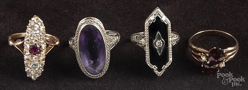 Four precious stone rings, to include a yellow gold, garnet, and pearl ring