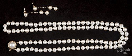 Saltwater pearl necklace and earring set with a 32'' strand of 7mm pearls with a 14K gold clasp