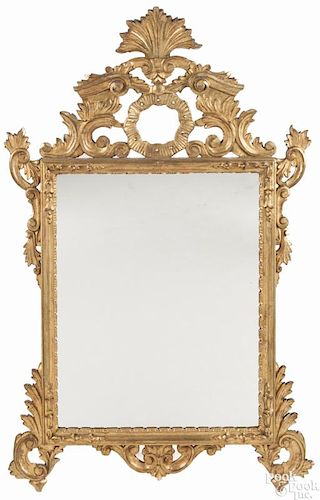 French giltwood mirror, ca. 1800, with scrolled foliate carving, overall - 44'' h., 28 1/4'' w.