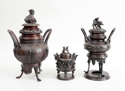 THREE CHINESE ARCHAIC STYLE BRONZE TRIPOD CENSERS AND COVERS WITH FU DOG KNOPS