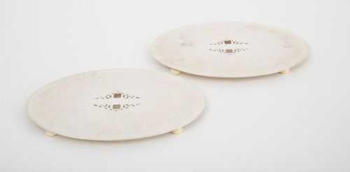 PAIR OF ENGLISH SILVER-PLATED ENTREE DISHES AND COVERS AND A PAIR OF SILVER-PLATED TRIVETS