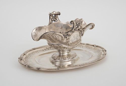 FRENCH MONOGRAMMED SILVER DOUBLE-SPOUTED SAUCE BOAT AND ATTACHED STAND