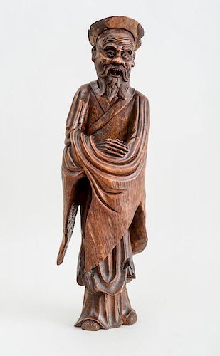 CHINESE CARVED HARDWOOD FIGURE OF AN IMMORTAL