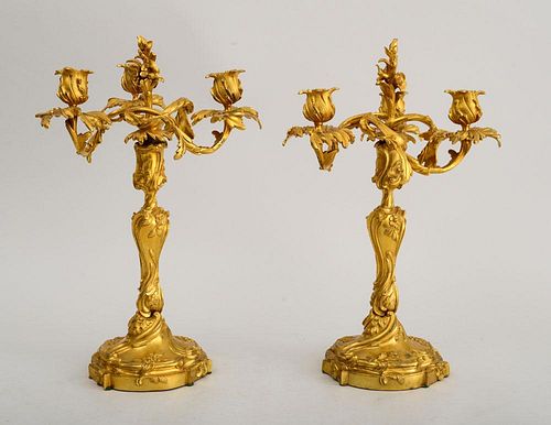 PAIR OF LOUIS XV STYLE GILT-BRONZE CANDLESTICKS, FITTED WITH THREE-BRANCH ARM SECTIONS