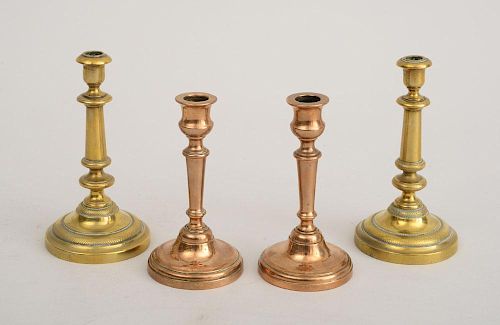 PAIR OF FRENCH BRASS TAPERSTICKS AND A PAIR OF FRENCH BELL METAL TAPERSTICKS
