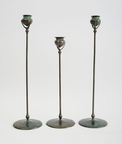 PAIR OF TIFFANY STUDIOS BRONZE TALL CANDLESTICKS AND SINGLE STICK