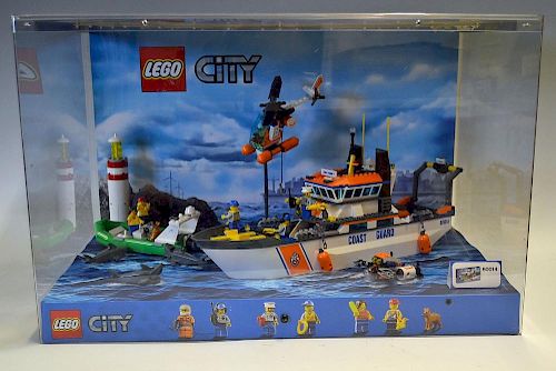 Lego Shop Display featuring Lego City No 60014 Coast Guard Set all house in a plastic display case w