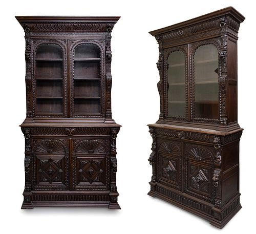 Important pair of Renaissance-style cabinets. Spain or France, second half of the 19th century. 
Carved oak wood and glass. 
With keys.