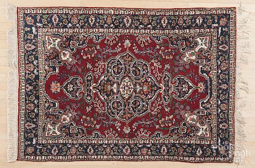 Three semi-antique Persian throw rugs, 5'9'' x 4', 5' x 3'5'', and 5' x 3'3''.